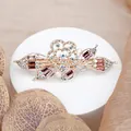 Eleganter goldener Blumen-Haarclip mit lila Kristallen und funkelnden Zirkonien - Rote Rose