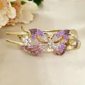 Elegant purple crystal butterfly hair claw clip with golden alloy base on satin - Purple