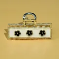 Elegant golden alloy hair claw with white base and three black floral decorative patterns - Rectangular Flower Style