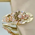 Eleganter goldener Blumen-Haarclip mit bernsteinfarbenen Kristallen und Strasssteinen - Champagner