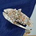 Champagne gold swallowtail hair claw clip with floral rhinestones on navy velvet - Champagne