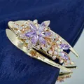 Elegant gold flower hair clip featuring purple marquise crystals and iridescent rhinestones - Lavender