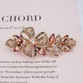 Barrette papillon fleur or rose ornée de strass champagne et de cristaux - Papillon Jaune
