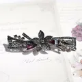 Gunmetal flower hair clip with champagne and purple rhinestones on a vintage card - Gun Black Purple Star Flower