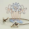 Elegant rose gold hair comb featuring crystal butterfly and floral rhinestone motifs - White