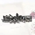 Gun black vintage flower hair clip with grey rhinestones on an elegant retro postcard - Gun Black Black Star Flower