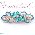 Blue rhinestone spring hair clip with gold alloy base and crystal flower detail - Blue Tone