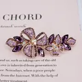 Pince à cheveux papillon en cristal violet avec strass floraux et finition or rose - Papillon Violet