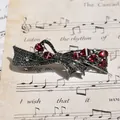 Vintage gun-black bow hair clip featuring red pear-cut gems and rhinestones - Gun Black Red Ribbon