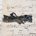 Bow-shaped hair clip with deep blue crystal teardrops and grey rhinestones in gun black - Gun Black Blue Ribbon