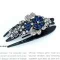 Elegant black hair claw clip featuring deep blue rhinestones and silver floral metalwork - Blue Butterfly Flower