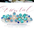 Floral rhinestone hair clip with blue crystals and a polished gold metal base - Teal Green Flower