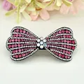Fermaglio a farfalla con strass rosa e fiore di cristallo colorato per capelli - Rosso Fiocco