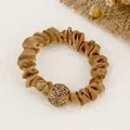 Elegant champagne gold satin scrunchie featuring a large sparkling rhinestone sphere - Satin / Ginger Yellow