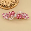 Elegante fermaglio per capelli in oro rosa con strass rosa e cristalli a goccia - Stile Fiocco / Petalo Rosso
