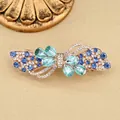 Elegant rose gold flower spring clip with blue rhinestones in a butterfly design - Blue Petal