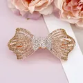 Barrette à cheveux nœud avec strass champagne sur base en alliage d'or rose - Jaune Étincelant
