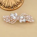 Elegant rose gold hair clip with sparkling crystals in an asymmetrical wing design - White Petal
