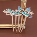 Elegant butterfly hair comb in rose gold finish with blue crystal and floral details - Butterfly Blue