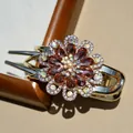 Elegant floral hair claw clip with brown crystals and rhinestones in gold and silver finish - Champagne