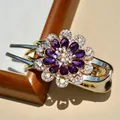 Elegant gold hair clip featuring purple crystal flower petals and sparkling rhinestones - Purple