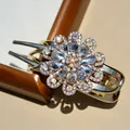 Sparkling crystal flower hair claw clip with golden metal rhinestones in elegant floral shape - White
