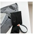 Black leather crossbody box bag featuring creative suit and tie patchwork design - Black