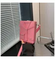 Chic pink box-shaped crossbody bag with unique suit jacket design and pebble leather - Pink