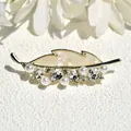 Elegant gold leaf brooch with iridescent shell inlay, pearls, and crystals for suits - Poplar Leaf