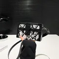 Fashionable box-shaped shoulder bag featuring black and white python print leather - White