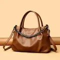 Deep brown faux leather tote bag with lychee texture and adjustable metal chain strap - Yellow Brown