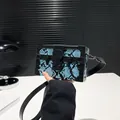Blue snakeskin box handbag with black leather trim and vintage metal clasp - Blue
