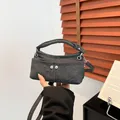 Chic charcoal grey denim handbag with dual metal buckles and adjustable strap - Black