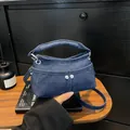 Mini denim crossbody bag in deep blue finish with silver buttons and top handle - Dark Blue