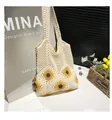 Close-up of handmade hollow straw tote bag featuring yellow sunflower crochet patterns - With Pendant / White Type 1
