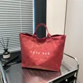 Red printed tote bag with unique wrinkled paper texture and spacious interior design - One Size / Red