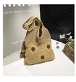 Detail of sunflower crochet pattern on a beige woven tote bag with hollow knit texture - With Pendant / Khaki