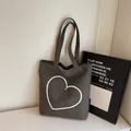Charcoal grey canvas tote bag with white heart embroidery and metal stud detail - Dark Brown