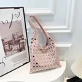 Pink leather hobo bag with silver metallic studs in a trendy retro Y2K style - Pink