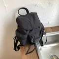 Black checkered canvas backpack with ribbon zipper pulls and multi-pocket design - Black