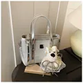Silver sequin bucket bag for women with shiny metallic trim and plush puppy charm - Large / Silver