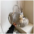 Metallic silver bucket bag with crocodile texture and cute white puppy plush charm - Large / Silver Wave
