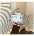 Metallic silver women's handbag with textured finish, stylish belt buckle, and crossbody strap - One Size / Silver
