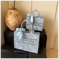 Blue and white paisley pattern tote bags with silk ribbon and embroidered logo details - Large / Light Blue