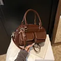 Retro dark brown glossy underarm pillow bag with two front pockets and handles - One Size / Coffee