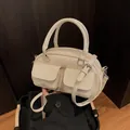 Vintage cream faux leather boston bag with dual front pockets and silver hardware detail - One Size / Off White