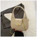 Elegant cream woven crossbody bag with gold chain strap and sleek metallic twist lock - One Size / White