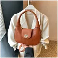 Caramel brown woven handbag with gold chain strap and textured leather finish - One Size / Brown