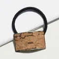 Elastic black hair tie with rectangular gold metal frame and natural cork texture inlay - Mountain Life
