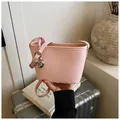 Pink woven texture bucket bag with heart charm and adjustable strap for women - Pink